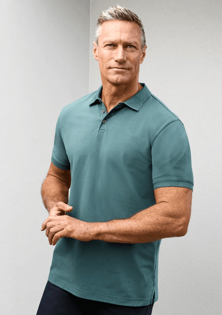 Team member wearing a polo decorated with an embroidered company logo